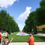 Wizualizacja Alei Zakochanych - drzewa posadzone wokół dywanu kwiatowego, po parku spacerują ludzie
