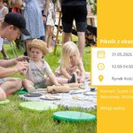 Grafika ze zdjęciem rodziny bawiącej się na kocu podczas pikniku i tekst „Piknik z okazji Dnia Dziecka 31.05.2026 (niedziela) 12:00-14:00 Rynek Kościuszki 4”.